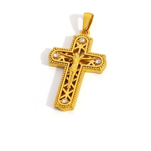 Detail of gold-plated stainless steel cross pendant with Virgin Mary and white zircons