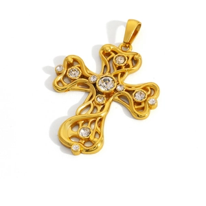 Close-up of a vintage gold-plated hollow cross pendant with sparkling clear zircons