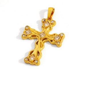 Close-up of vintage gold cross pendant featuring sparkling cubic zirconia stones