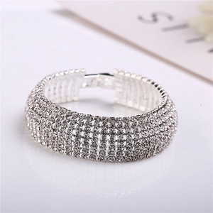 Elegant silver-colored wide rhinestone bracelet featuring multi-row crystal pavé setting