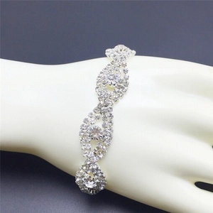 Detail view of infinity-link rhinestone bracelet with sparkling silver claw setting