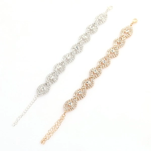Fashion rhinestone bracelet set in gold and silver finish with infinity wave design