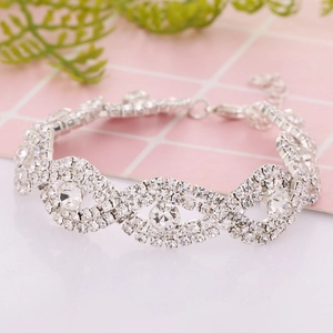 Silver rhinestone bracelet with eye-shaped circular crystals and lobster clasp closure
