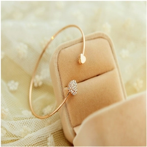 Elegant rose gold open heart bracelet with sparkling crystals on velvet box display