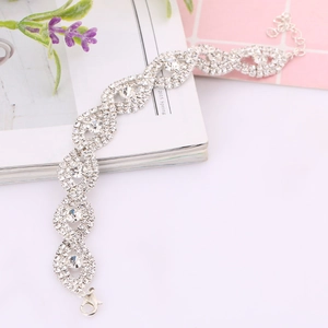 Detail of silver-tone rhinestone bracelet showing lobster clasp and adjustable link chain