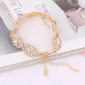 Elegant gold rhinestone bracelet for women featuring oval eye links and lobster clasp closure