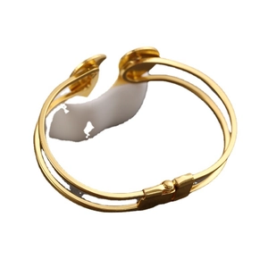 Minimalist double-row open heart bracelet in polished gold finish for women