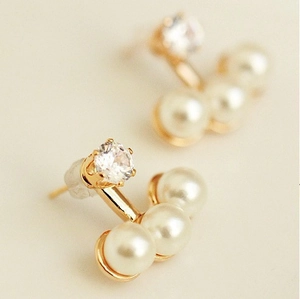 Elegant gold earrings featuring a brilliant round crystal and three horizontal white pearls