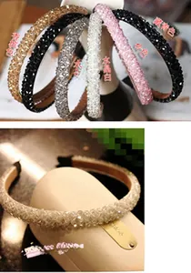 Detail of multi-row crystal beaded headband in various colors with metallic base