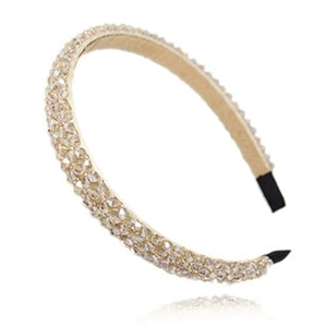Elegant wide headband with champagne crystal beads on a thin metal frame with soft tips