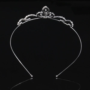 Elegant silver rhinestone crown headband for girls with wave pattern and polished reflection