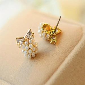 Elegant bowknot stud earrings with clear zircon and white pearl cluster in gold plating