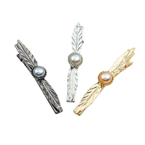 Vintage metal leaf hair clips with pearl accent in silver, gunmetal, and gold finishes