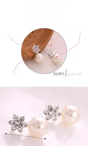 Detail of star rhinestone pearl earrings with dimensions 2.5x1.2cm shown in close-up view