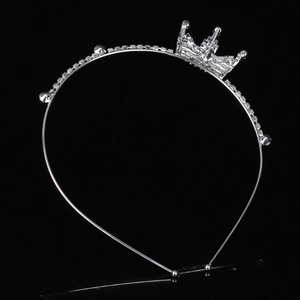 Sparkling silver rhinestone tiara headband for girls with crown ornament on black background