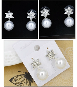 Detail of snowflake star earrings with large round pearls and rhinestone inlay sets