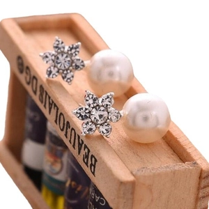 Elegant snowflake jacket earrings with sparkling rhinestones and white pearls