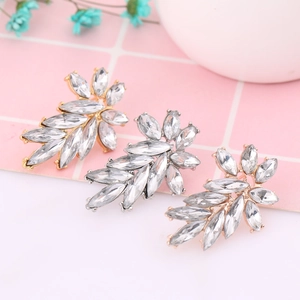 Elegant wing-shaped rhinestone earrings in gold and silver plating with marquise-cut crystals