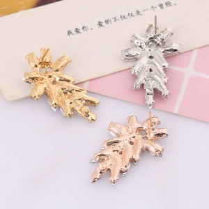 Detailed back view of irregular leaf stud earrings in gold, silver and rose gold