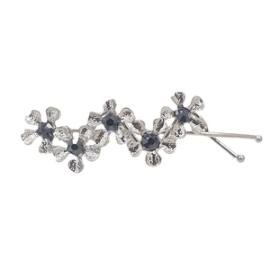 Silver wavy floral hair pin featuring five S-shaped flowers with deep blue crystals