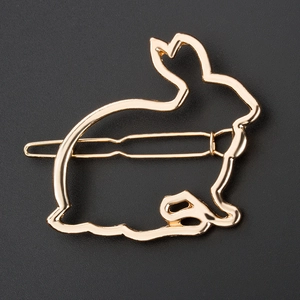 Minimalistische hohle Metall-Hasen-Haarklammer in Gold-Finish aus der Draufsicht