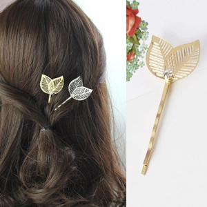 Barrette à cheveux dorée en forme de feuille avec design ajouré et accent de cristal