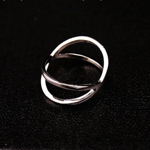 Polished silver minimalist crisscross open ring with a sleek double line X-shaped design