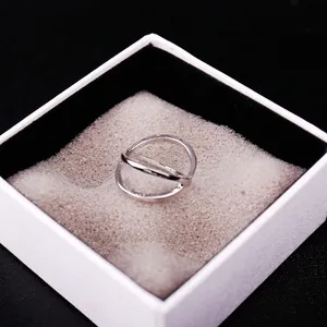 Minimalist silver-tone crisscross ring with double band design in jewelry gift box