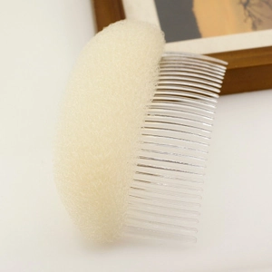 Detail of sponge hair pad with plastic comb for volumizing bangs and creating a puff hairstyle