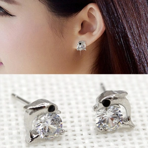 Detail view showing dolphin stud earrings with silver finish and large round cubic zirconia