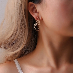 Elegant gold metal hollow-out finger heart gesture earrings for women in Korean fashion style