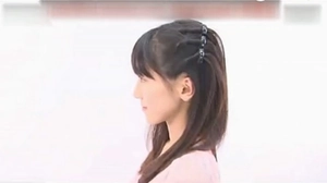 Detail view of black dual-layer hair clips for styling and securing side fringe