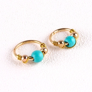 Bohemian gold wire wrapped nose rings with turquoise beads and metallic accents