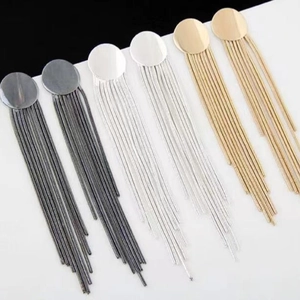 Three pairs of elegant tassel earrings in gunmetal, silver, and gold finishes with metal chains