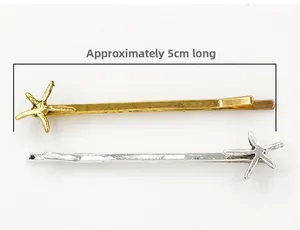 Detailed view of 5cm gold and silver starfish hair clips with a classic metal design