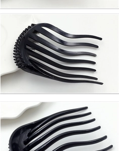 Detail of black plastic hair volume clip with curved teeth for Korean style styling