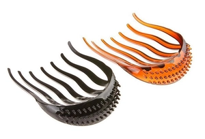 Detail view of black and amber hair volume pads with non-slip texture for hairstyling