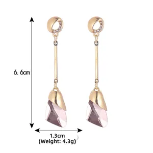 Detail showing elegant 6.6cm long crystal teardrop earrings with gold plating and size labels