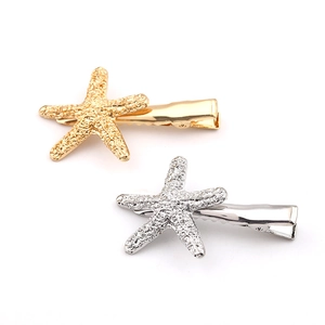 Barrettes étoile de mer en or et argent avec surface métallique texturée réaliste