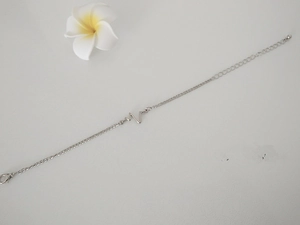 Close-up of minimalist silver ECG lightning bracelet with adjustable lobster clasp