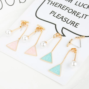 Detail of pink and blue marble triangle earrings with pearls and gold bar studs