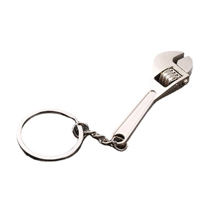 Creative metal alloy adjustable wrench keychain for car keys on a white background