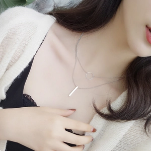 Minimalist silver double-layered necklace with geometric circle and vertical bar pendants