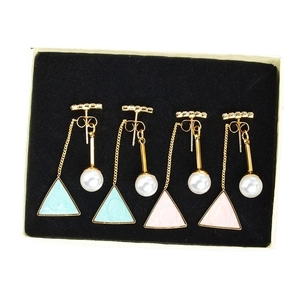 Elegant geometric earrings set with pearls and triangle charms in a gift box