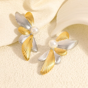 Artistic two-tone wing-shaped stainless steel earrings with white pearl accents