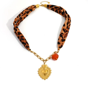Leopard print silk scarf necklace with golden heart pendant and evil eye design