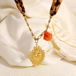 Leopard print silk scarf necklace with golden heart pendant and evil eye charm