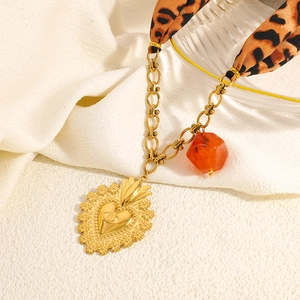 Retro leopard print scarf necklace with golden heart pendant and orange resin bead