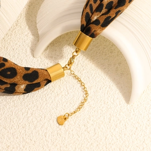 Leopard print fabric necklace with gold stainless steel hardware and heart pendant