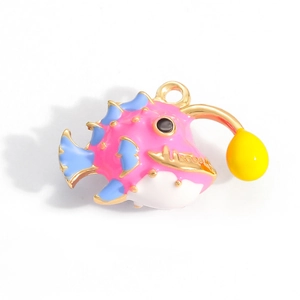 Detailed close-up of a cartoon anglerfish pendant with pink and blue enamel finish
